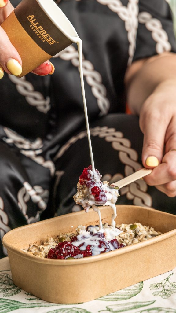 Pouring Milk over LifeGrain's Oat and Chia Porridge