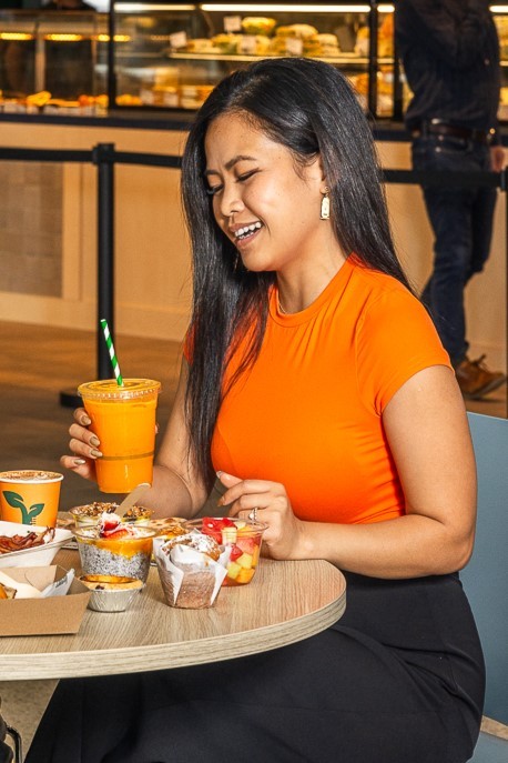 Female Customer holding fresh juice zing flavour at LifeGrain Cafe Prince of Wales Hospital Acute Services Building